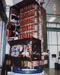 822: RXTE during integration and test at Goddard Space Flight Center showing the two HEXTE clusters below the five PCA detectors which have their red protective covers in place. The teo star trackers are located at the ends of the two black cones (baffles) on the side.