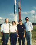 827: The three RXTE principal investigators and the Program Manager at Cape Canaveral Air Force Station in front of the Delta II launcher with RXTE inside the protective shroud. Left to right: Dr. Hale Bradt (ASM PI), Dr Jean Swank (RXTE Project Scientist and PCA PI), Mr Dale Schultz (Program Manager), and Dr. Richard Rothschild (HEXTE PI).